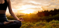 Young woman practicing yoga in the nature