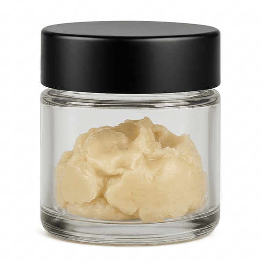 Glass jar with black lid containing THCA badder