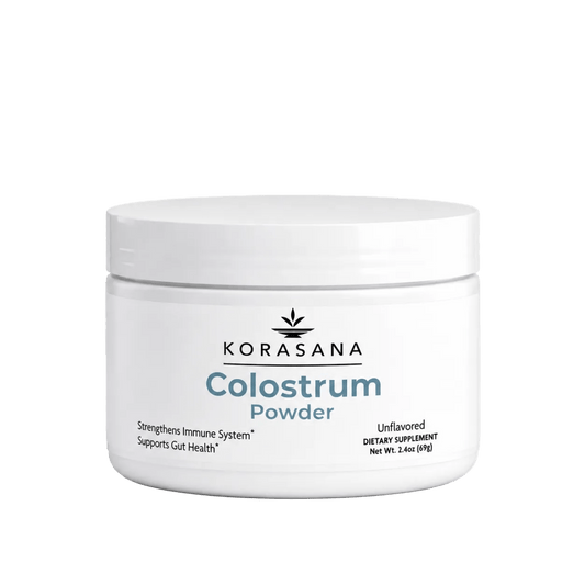A white plastic jar of KORASANA Colostrum Powder on a clean white background.