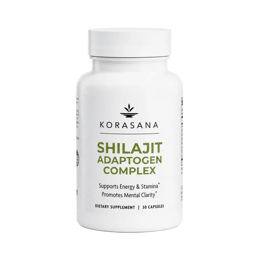 A white bottle of Korasana Shilajit Adaptogen Complex dietary supplement, featuring a white cap and a clean white label with green and black text, set against a light gray background.